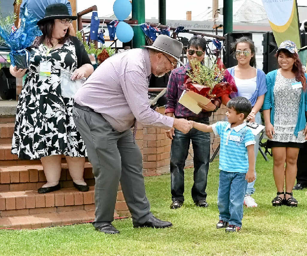 WELCOME: Mayor Peter Blundell welcomes Warwick’s newest citizens, including Mark Masculino at the Australia Day celebrations in Leslie Park yesterday. WELCOME: Mayor Peter Blundell welcomes Warwick’s newest citizens, including Mark Masculino at the Australia Day celebrations in Leslie Park yesterday.